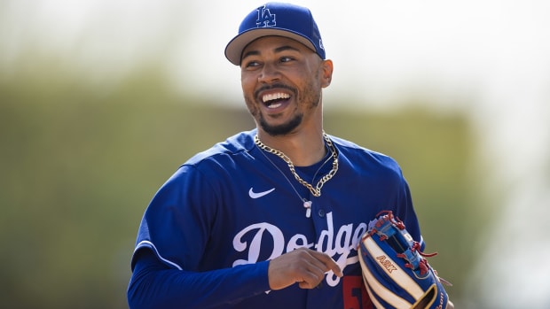 Mookie Betts smiles during a spring training game.